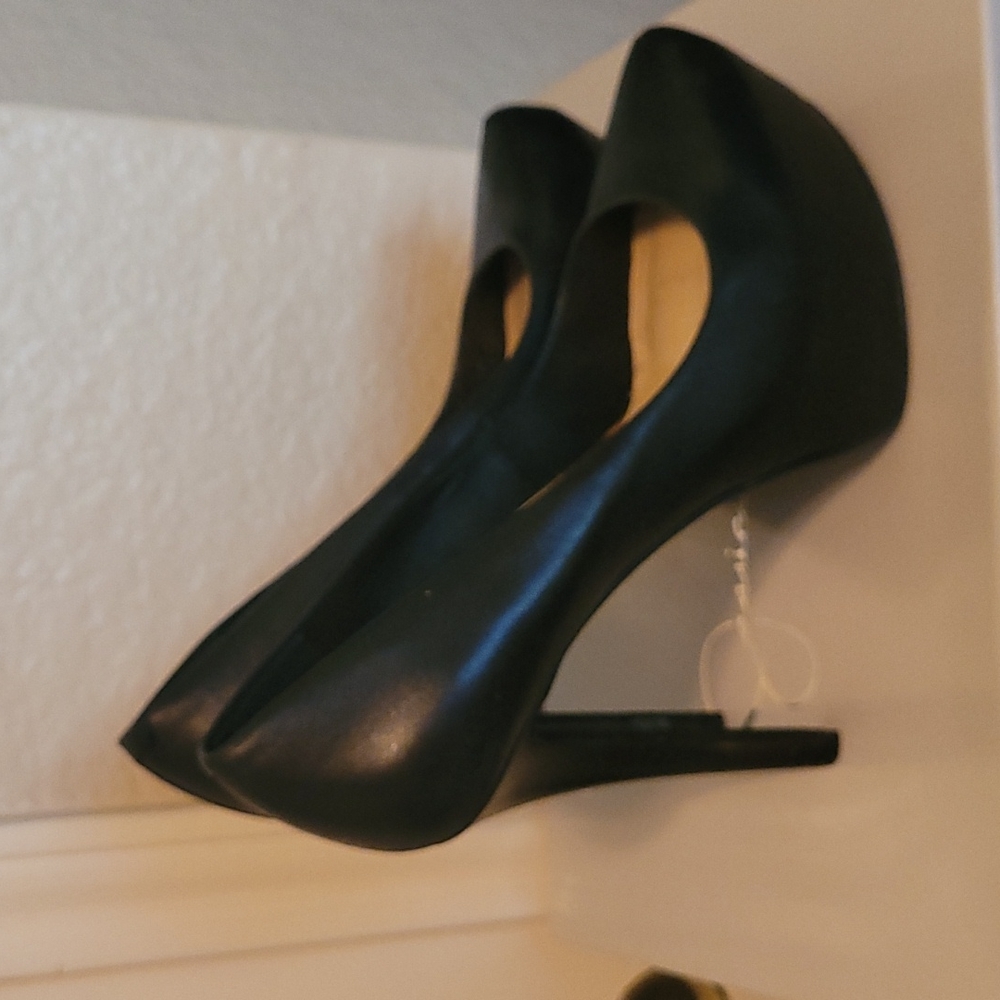 Jessica Simpson black platform pumps.